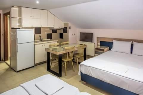 Η κουζίνα ή μικρή κουζίνα στο Le Monde SeaView Suites