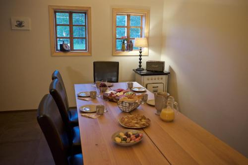 a wooden table with food on top of it at Íslandsbærinn /Old Farm in Akureyri