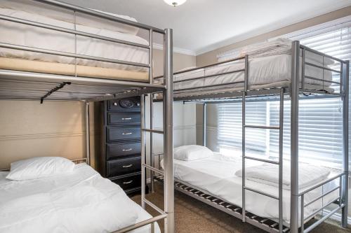 a bedroom with two bunk beds and a window at Sweetwater Lift Lodge in Park City