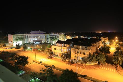 a city at night with buildings and street lights at PSA Nghi Sơn Condotel in Thanh Hóa