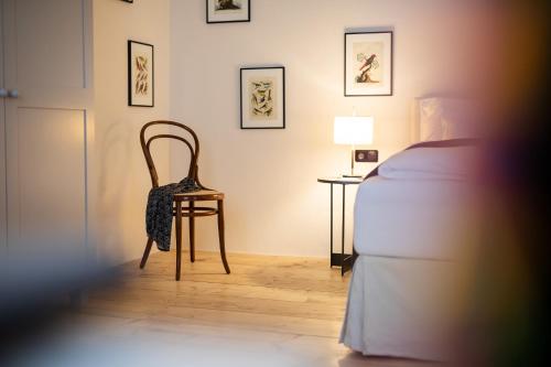 Postel nebo postele na pokoji v ubytování Boutique Hotel Zum Oberjäger, Schloss Lackenbach