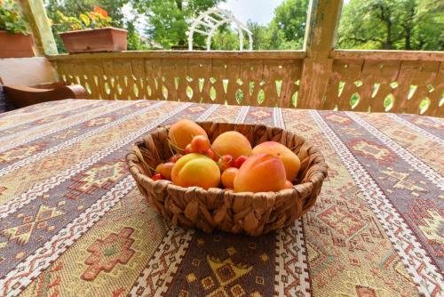 a bowl of fruit sitting on a table at Holiday Home Ruben in Odzun