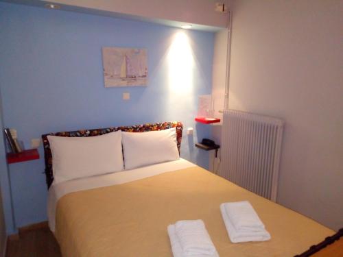 Posteľ alebo postele v izbe v ubytovaní Zappion Hotel