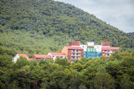 a group of buildings on top of a mountain at Muju Ilsung Condo in Muju
