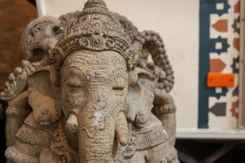 a statue of an elephant with a crown on its head at Treck Hostel in Ghent