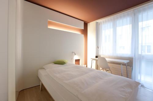 Cama o camas de una habitación en Hotel Dom, zentral - herzlich - sozial engagiert