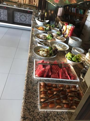 a buffet line with many different types of food at Hotel Grün in Kızılot