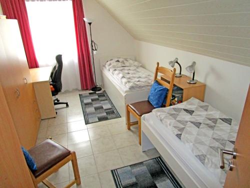 Ein Bett oder Betten in einem Zimmer der Unterkunft Villa Schwalbennest