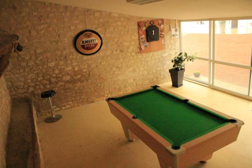 a room with a pool table in a room at La Massonnière Gîte et chambres d'hôtes in Mondion