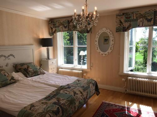 Säng eller sängar i ett rum på Hotell Plevnagården