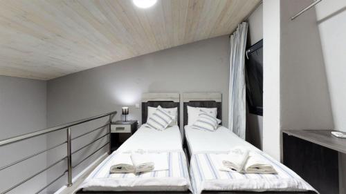 Ένα ή περισσότερα κρεβάτια σε δωμάτιο στο Paramithi Luxury Apartments