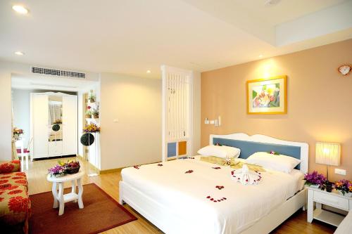 Кровать или кровати в номере The Beach Boutique House
