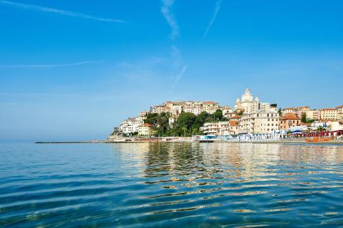 a view of a city from the water at Hotel Croce Di Malta in Imperia