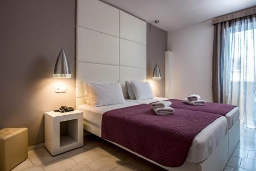 Ένα ή περισσότερα κρεβάτια σε δωμάτιο στο Galaxy Hotel