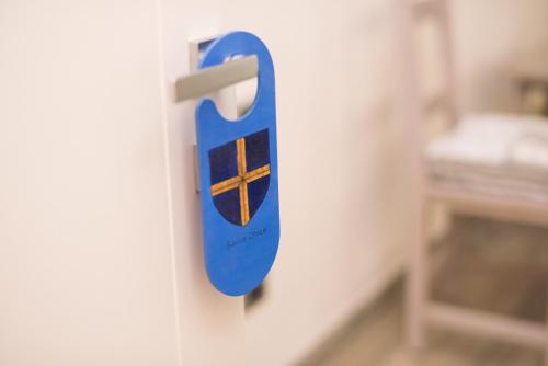 a blue door handle on a white wall at Florence Shabby Chic Home in Florence