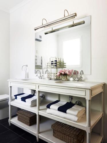 a bathroom with a sink and a mirror at Bells at Killcare Boutique Hotel, Restaurant & Spa in Killcare