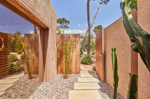 a door to a house with a cactus at Pleta de Mar, Grand Luxury Hotel by Nature - Adults Only in Canyamel