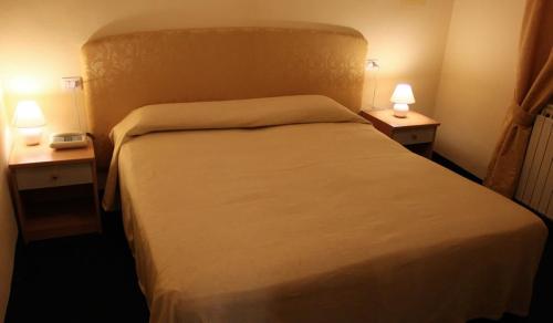 Postel nebo postele na pokoji v ubytování Hotel Romagna
