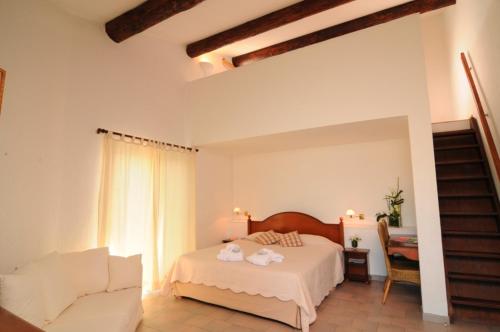 Postel nebo postele na pokoji v ubytování Hôtel L' Estelle en Camargue