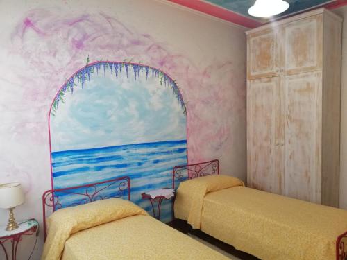 Łóżko lub łóżka w pokoju w obiekcie Terrazze dell'artista