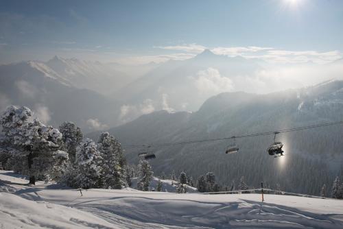 a ski lift in the snow on a mountain at Alpenchalet Brücke in Mayrhofen