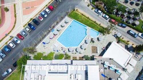 an overhead view of a pool in a parking lot at Georgioupolis Beach Hotel in Georgioupolis
