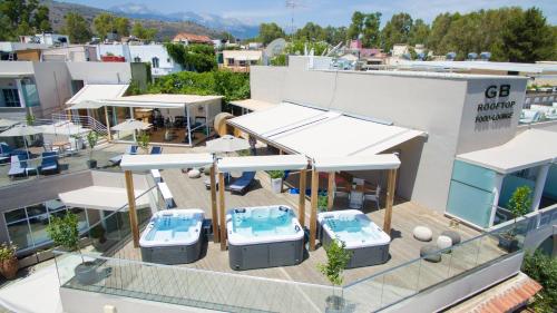 an overhead view of a building with tables and chairs at Georgioupolis Beach Hotel in Georgioupolis
