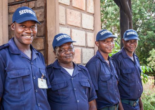 a group of men in blue shirts and hats at Bay View Lodge in Miramar