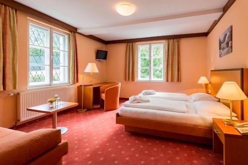 Un pat sau paturi într-o cameră la Hotel Restaurant Höldrichsmühle