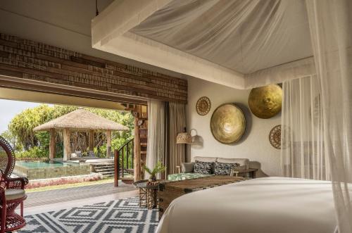 En eller flere senger på et rom på Four Seasons Resort Seychelles at Desroches Island