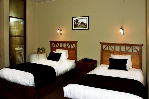 Ένα ή περισσότερα κρεβάτια σε δωμάτιο στο Hoteles Riviera Cayma