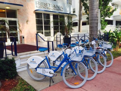 a group of bikes parked in front of a building at Pestana South Beach Hotel in Miami Beach