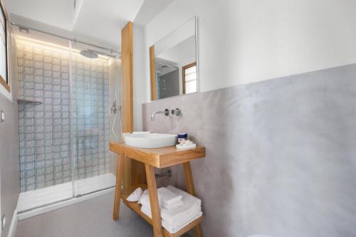 a bathroom with a sink and a shower at La Piazzetta Guest House in Sorrento