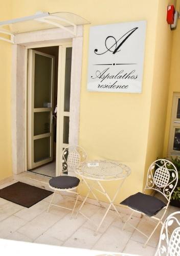 a table and chairs sitting on a patio at Aspalathos Residence in Split
