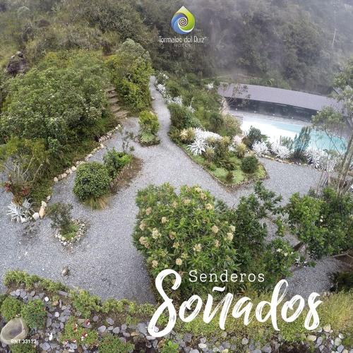 an aerial view of a garden with a pool at Hotel Termales del Ruiz in Manizales