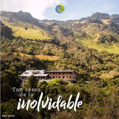 a picture of a house on a hill with a frisbee at Hotel Termales del Ruiz in Manizales