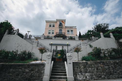 a house with stairs leading up to it at Villa Lussana in Teolo