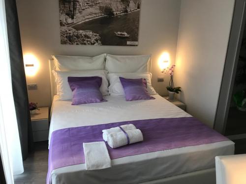Una cama o camas en una habitación de Sunset Tropea
