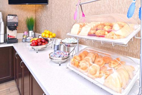 a kitchen counter with a bunch of food on it at Americas Best Value Inn-Near NRG Park/Medical Center in Houston