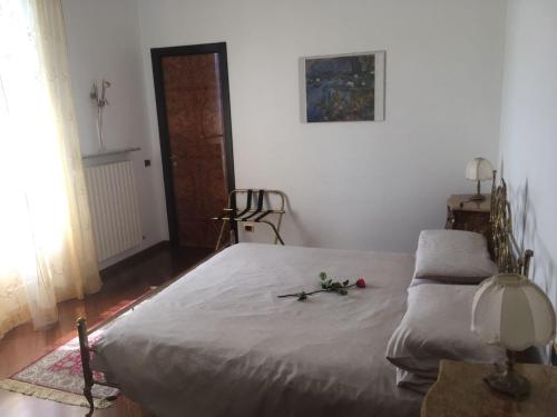 a bedroom with a large bed with flowers on it at Villa Puccini Bed & Breakfast in Lecco