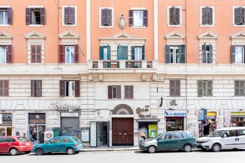 a group of cars parked in front of a building at Lilli Vatican White Domus in Rome