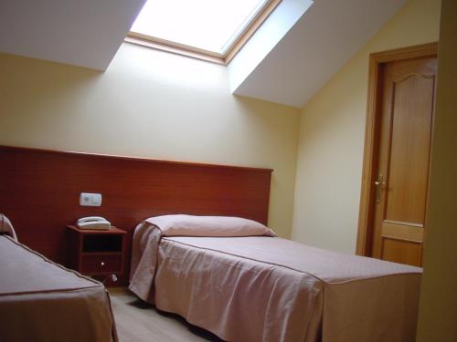 Ένα ή περισσότερα κρεβάτια σε δωμάτιο στο Hotel La Mora