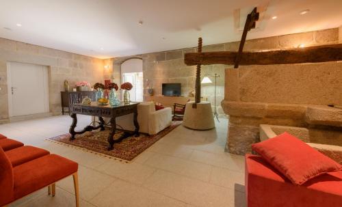 a living room with a couch and a table at Torre de Tebra in Tomiño