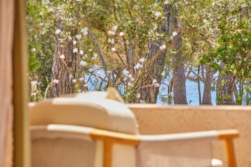 a white phone sitting on top of a window at Pleta de Mar, Grand Luxury Hotel by Nature - Adults Only in Canyamel