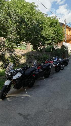 a row of motorcycles parked in a parking lot at Hôtel de Valdeblore in Valdeblore