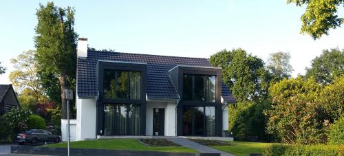 a house with a black roof at Intermezzo Emmerich in Emmerich