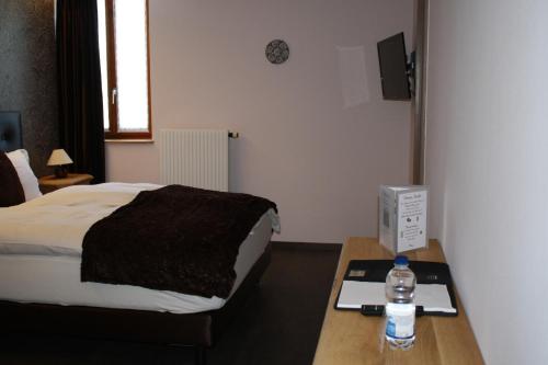 Postel nebo postele na pokoji v ubytování Hotel de la Gare