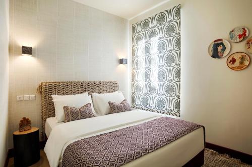 a bedroom with a bed and a window at The Frogs_Guest House in Athens
