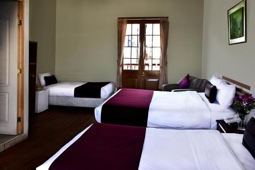 Ένα ή περισσότερα κρεβάτια σε δωμάτιο στο Hoteles Riviera Colonial