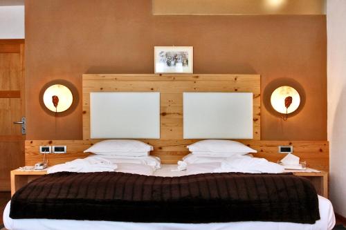 Postel nebo postele na pokoji v ubytování Hotel La Majun